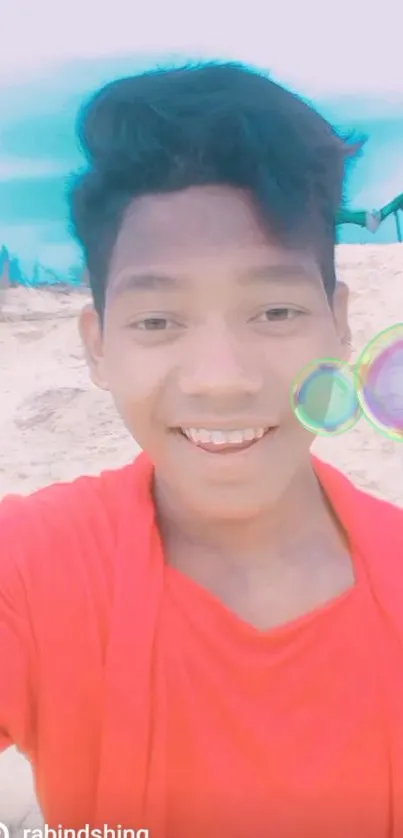 Smiling man in red on beach with colorful bubbles.