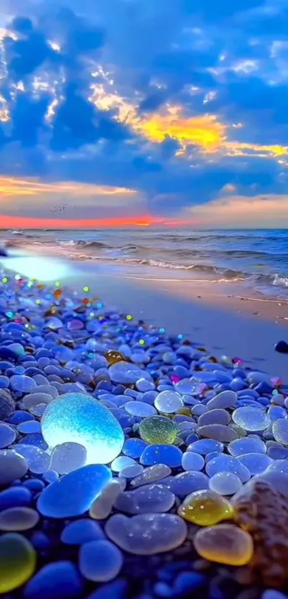 Vibrant stones on a beach with a stunning sunset over the ocean.