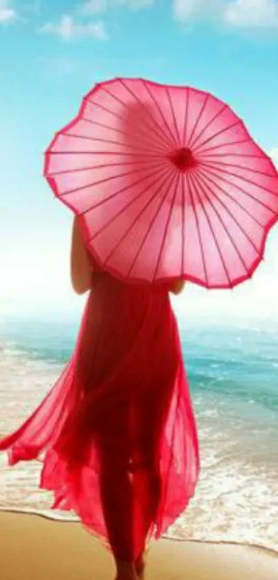 Person with pink umbrella strolling along a sunny beach, ocean waves visible.