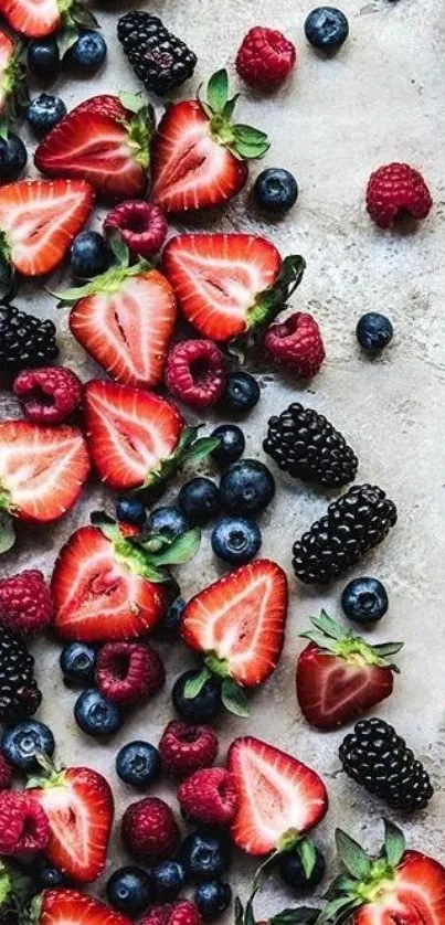 A colorful wallpaper showcasing strawberries, blueberries, and blackberries.