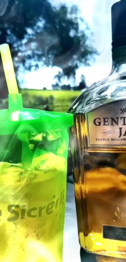 Glowing green cup and beverage bottle in an outdoor setting.