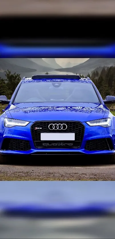 Blue Audi car parked on a scenic road with mountainous backdrop.