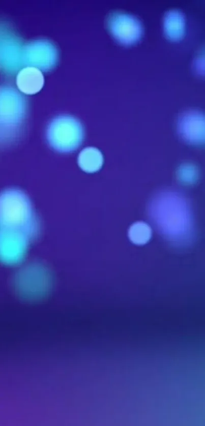 Vibrant blue bokeh wallpaper with glowing circles.