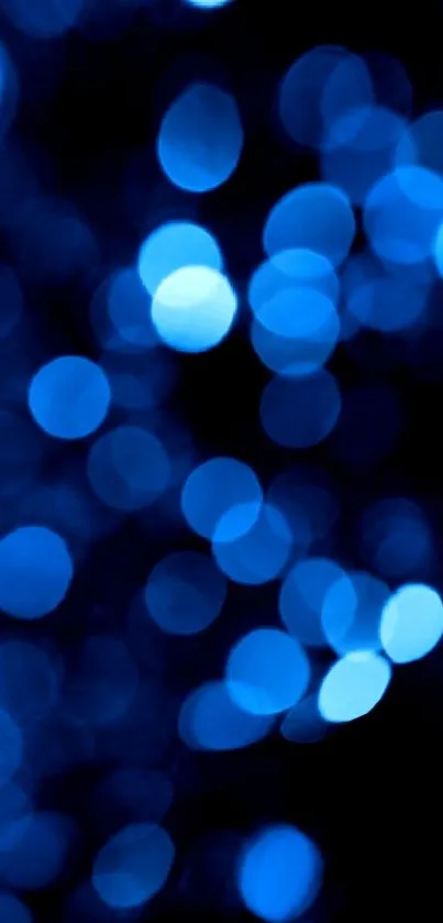 Vibrant blue bokeh wallpaper with glowing orbs creating a serene visual experience.