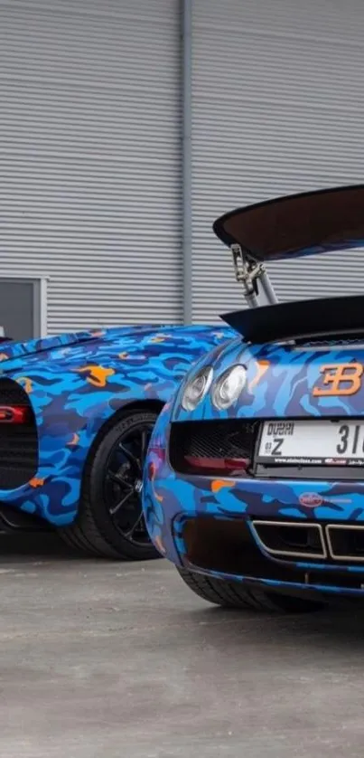 Blue camo luxury supercars parked outside.