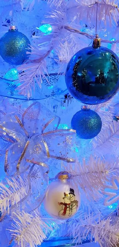 Blue and white Christmas tree with ornaments.