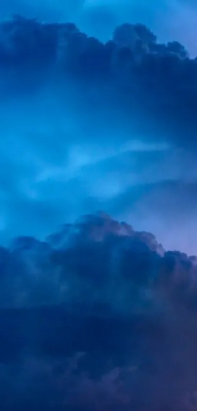 Vibrant blue clouds creating a serene phone wallpaper backdrop.