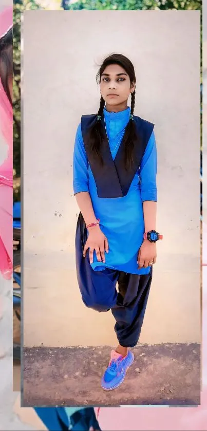 Vibrant blue fashion portrait against a wall.