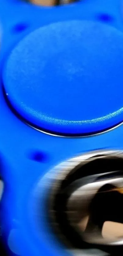 Close-up of a blue spinning fidget toy with dynamic motion effect.