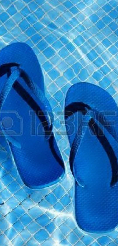 Blue flip-flops floating on a sunny pool surface, creating a vibrant summer scene.