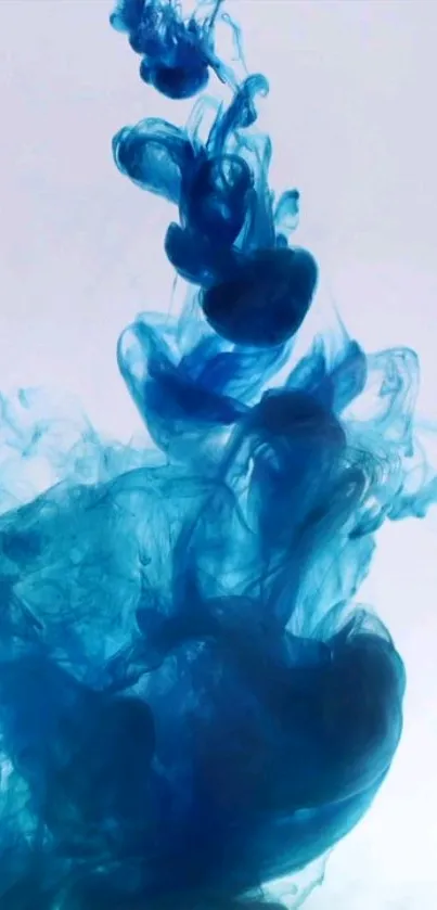 Vibrant blue ink swirling in fluid motion against a soft backdrop.