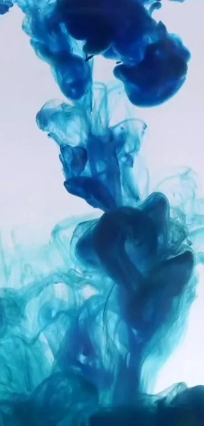 Vibrant blue ink swirls elegantly in water, creating a stunning visual display.