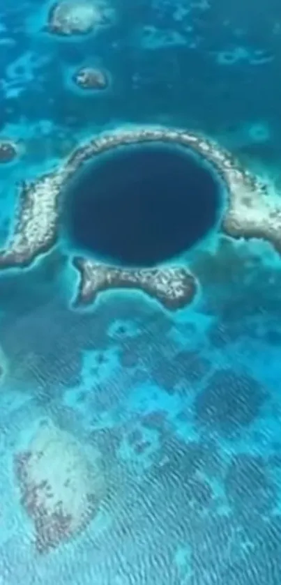 Aerial view of the Great Blue Hole with vibrant blue water.