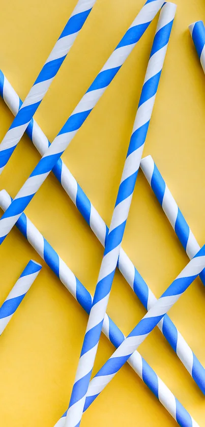 Blue and white striped straws on a yellow background wallpaper.