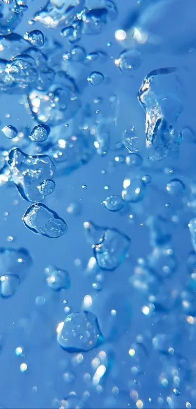 Sparkling blue water droplets wallpaper with a serene and calming effect.