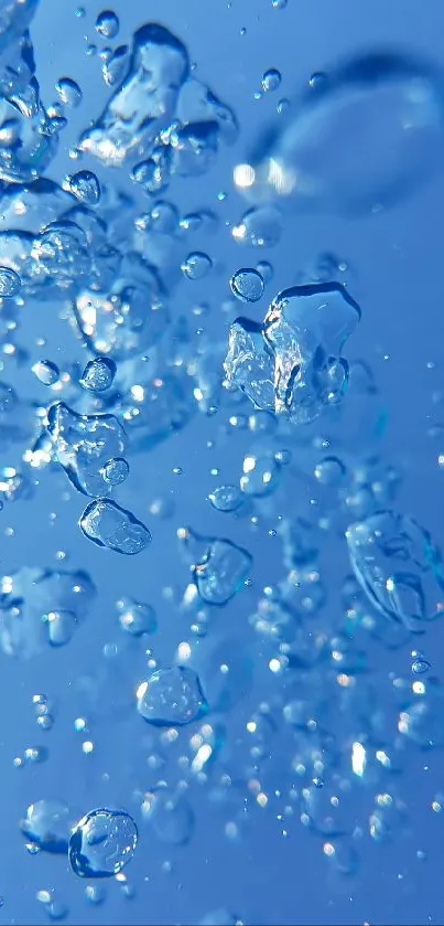 Vibrant blue water droplets against a sky blue background.