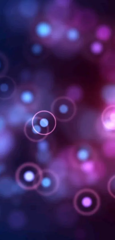 Vibrant bokeh wallpaper with purple and pink light orbs.