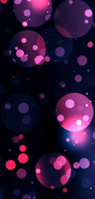 Vibrant pink and purple bubbles floating on a dark background wallpaper.