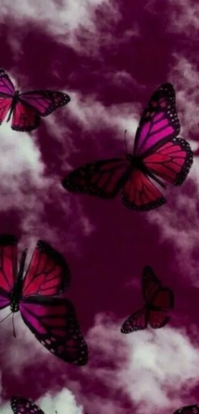 Pink butterflies fluttering in purple cloudy sky.