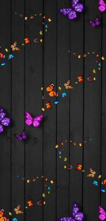 Colorful butterflies on dark wood wallpaper.