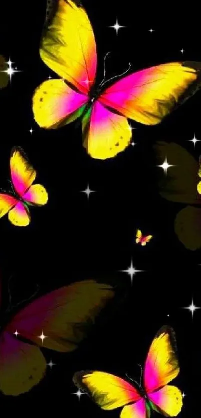 Vibrant pink and yellow butterflies on black wallpaper.