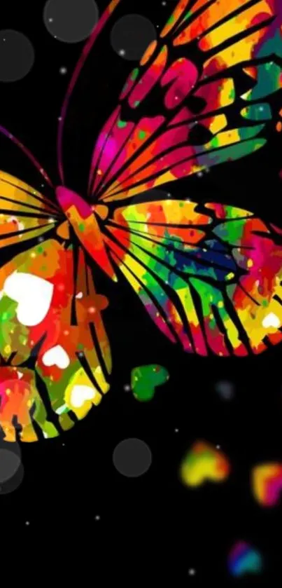 Colorful butterfly on black background with heart shapes.