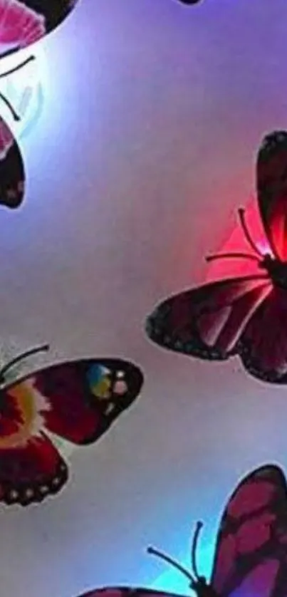 Colorful butterflies glowing with vibrant light on a dark background.