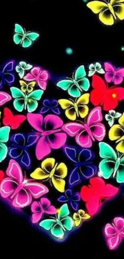 Colorful butterflies form a heart shape on a black background wallpaper.