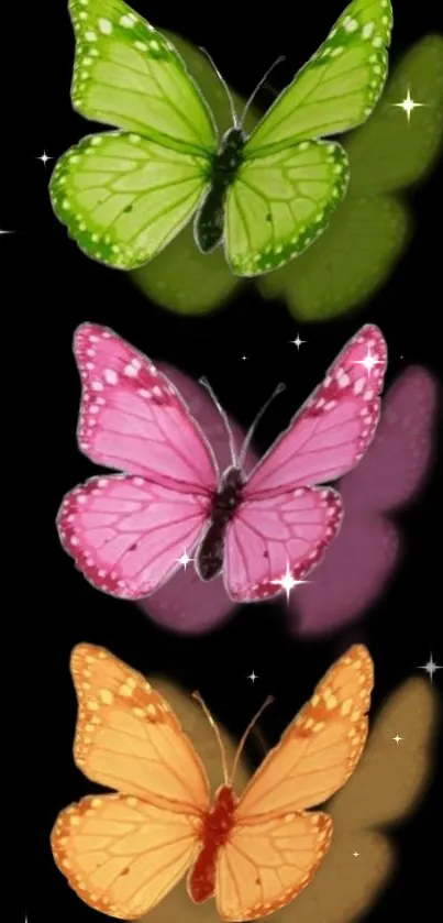 Colorful green, pink, and orange butterflies with black background.