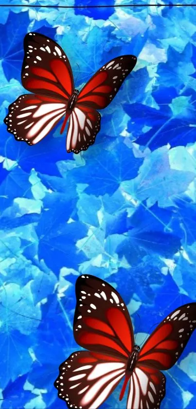 Red butterflies on a blue leaf background.