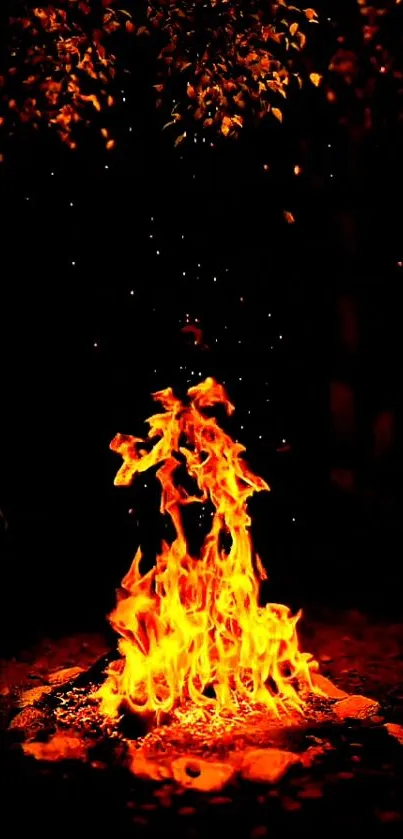 Vibrant orange campfire against dark background on mobile wallpaper.