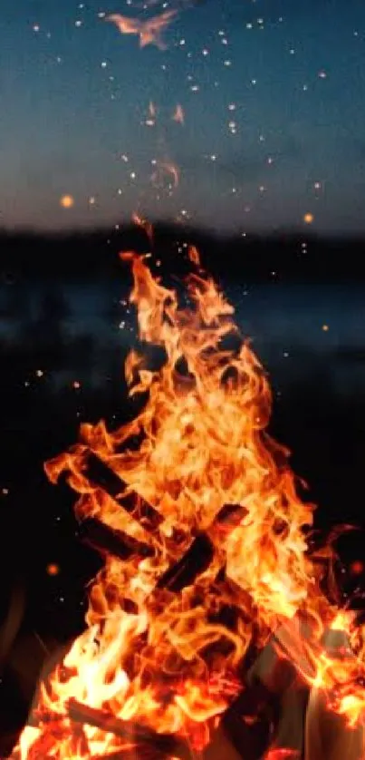 Vibrant campfire flames under a starry night sky.