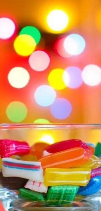 Brightly colored candy in a glass bowl with a bokeh background.