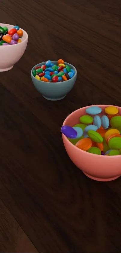 Colorful candies in bowls on a dark wooden table.