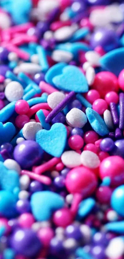 Colorful candy hearts in vibrant pink, blue, and purple hues.