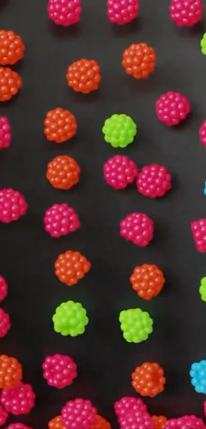 Colorful candy pattern wallpaper with spherical shapes on dark background.