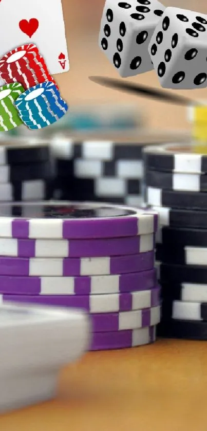 Colorful casino poker chips with dice and playing cards.