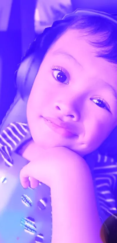 Child in headphones with purple hues, smiling playfully.