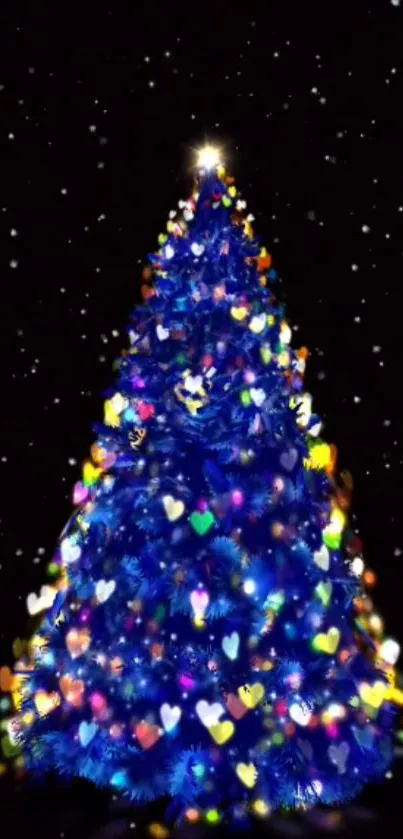 Vibrant blue Christmas tree with heart-shaped lights and a starry night backdrop.