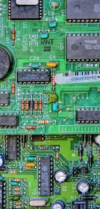 Close-up of a green circuit board with various electronic components.