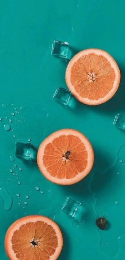 Bright orange slices with ice on teal backdrop.