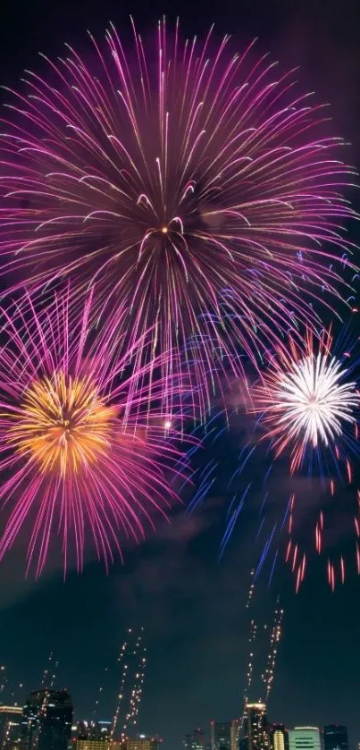 Vibrant fireworks display over city skyline at night.