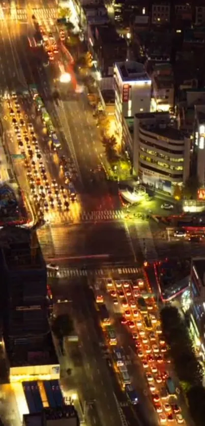 Aerial view of a vibrant city at night with illuminated streets.