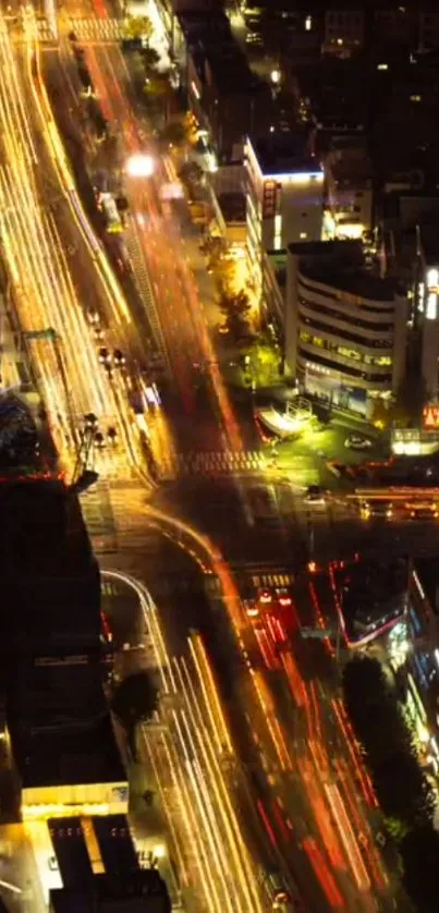 Dynamic aerial view of city traffic at night, showcasing vibrant urban lights.