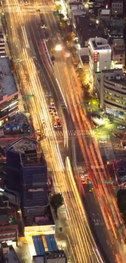 Aerial view of vibrant city street lights at night.