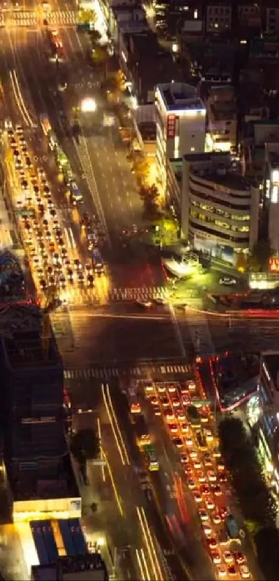 Aerial city view with illuminated streets at night.