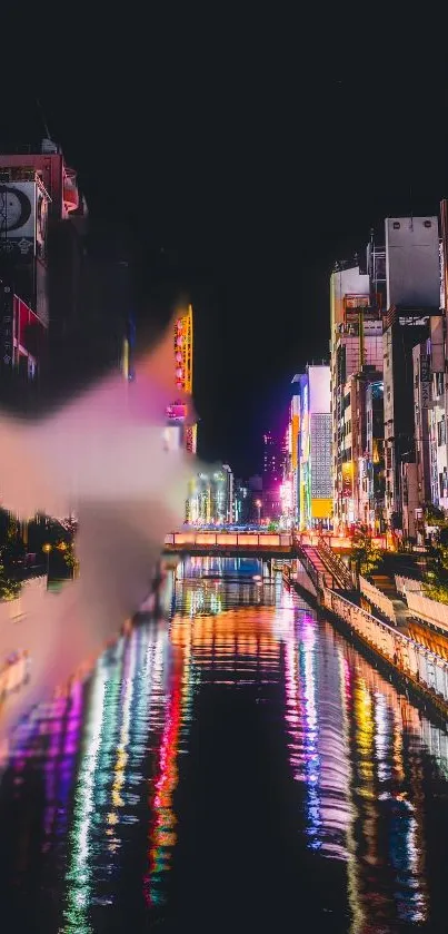 Colorful city skyline at night with vibrant river reflections.