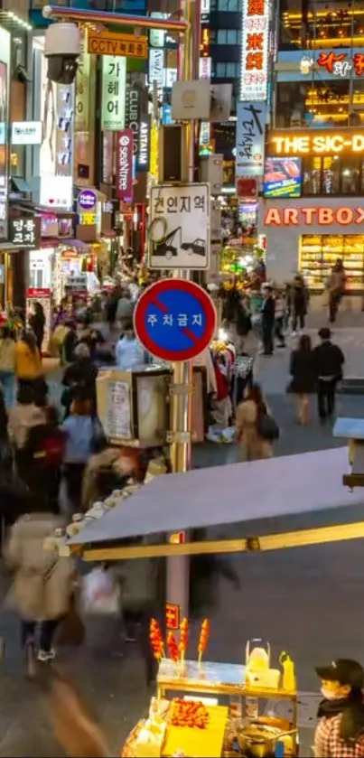 Busy city street with neon signs at night.