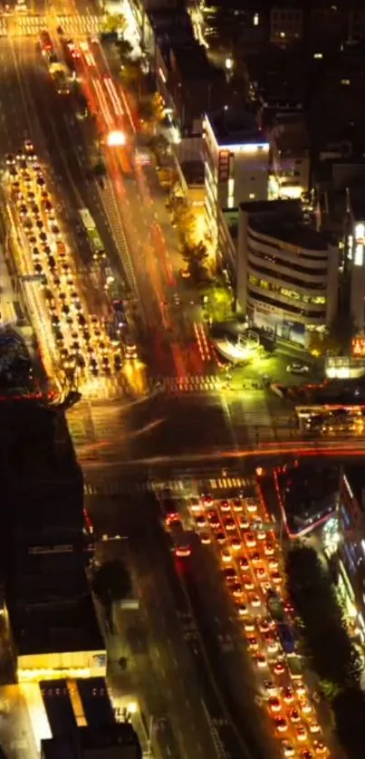 A vibrant city street glowing at night with cars and illuminated buildings.