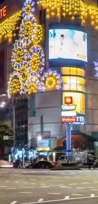 City building with vibrant night lights and colorful decorations.